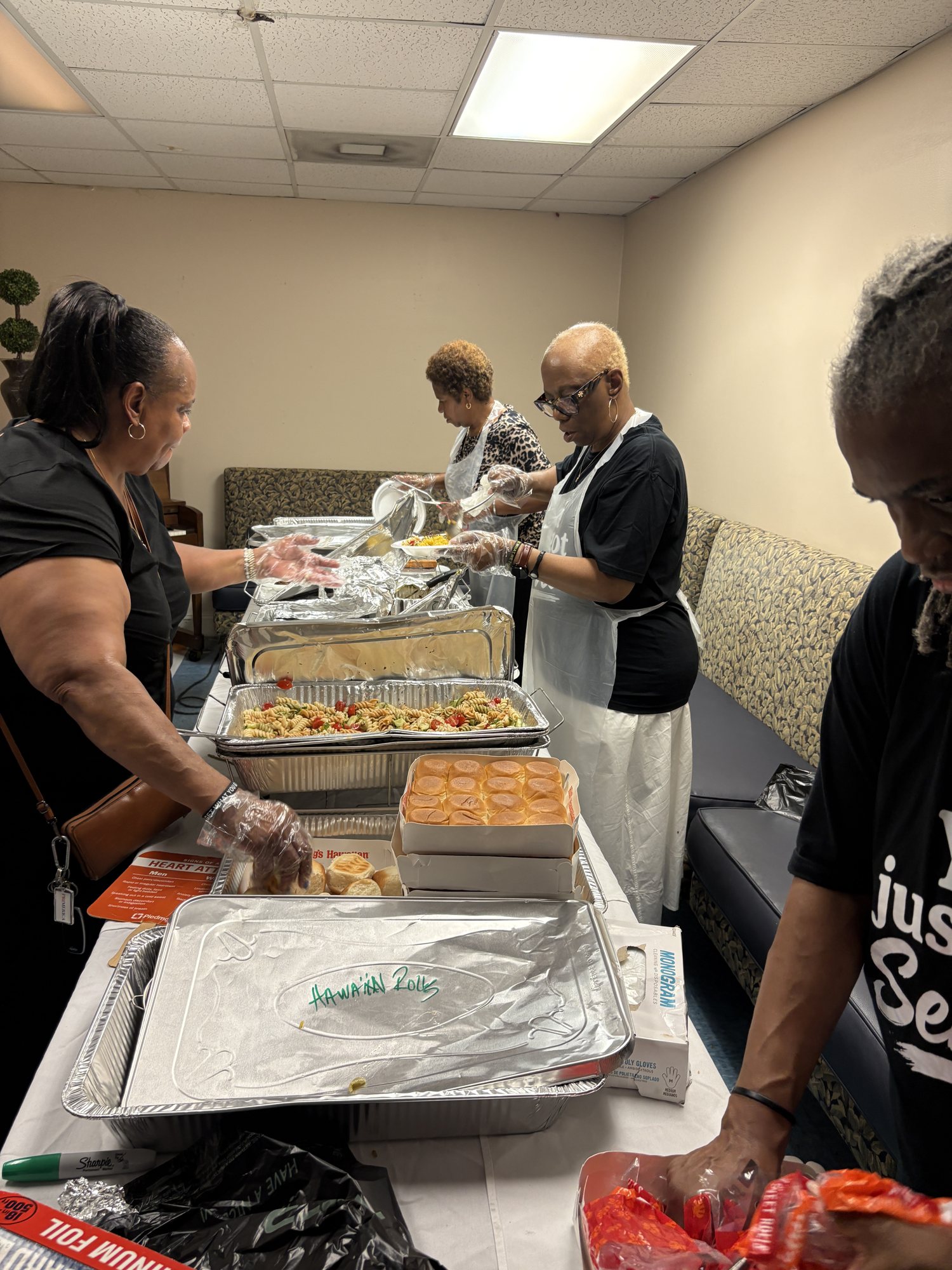 Freedom serve team members serving food at a church event