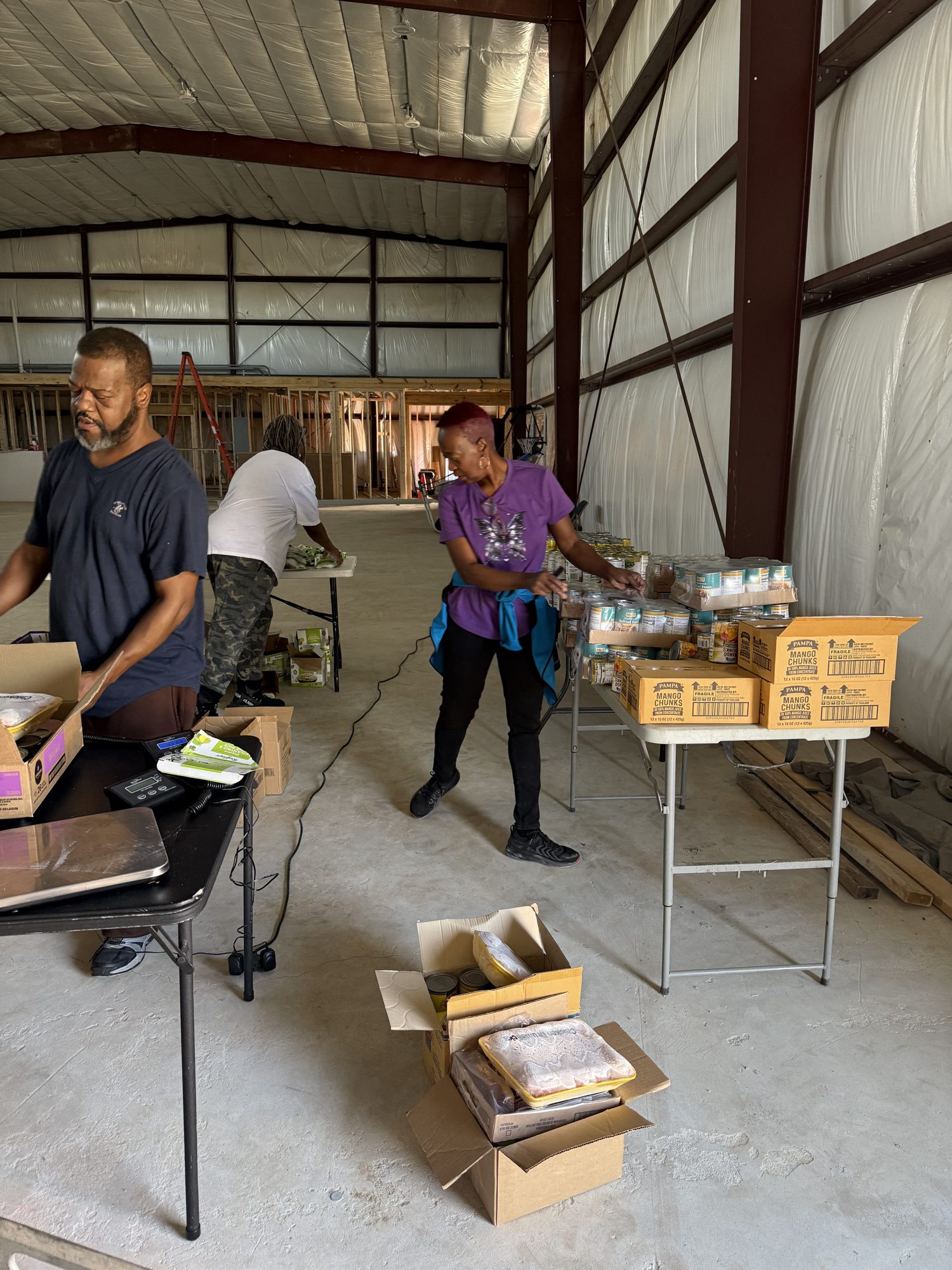 Freedom volunteers packing food boxes for the community